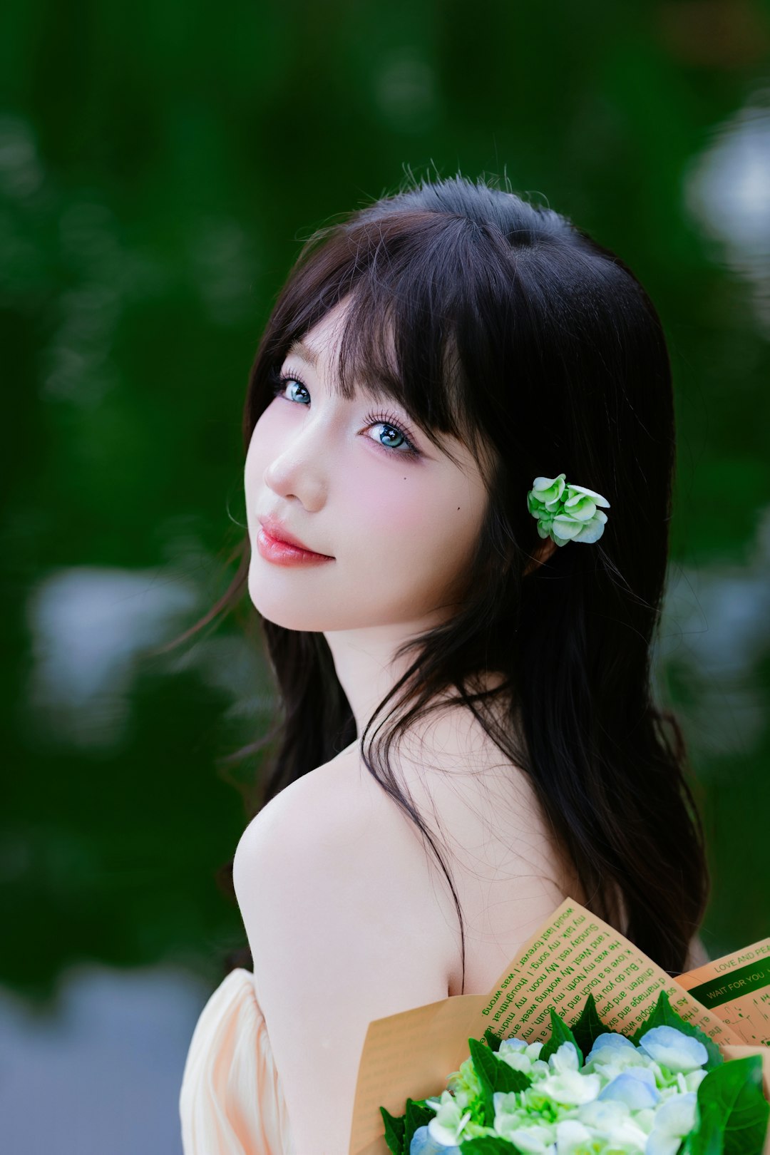 Young woman with flower in hair holds bouquet