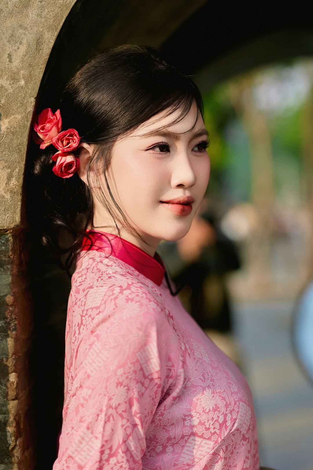 Young woman with roses in her hair