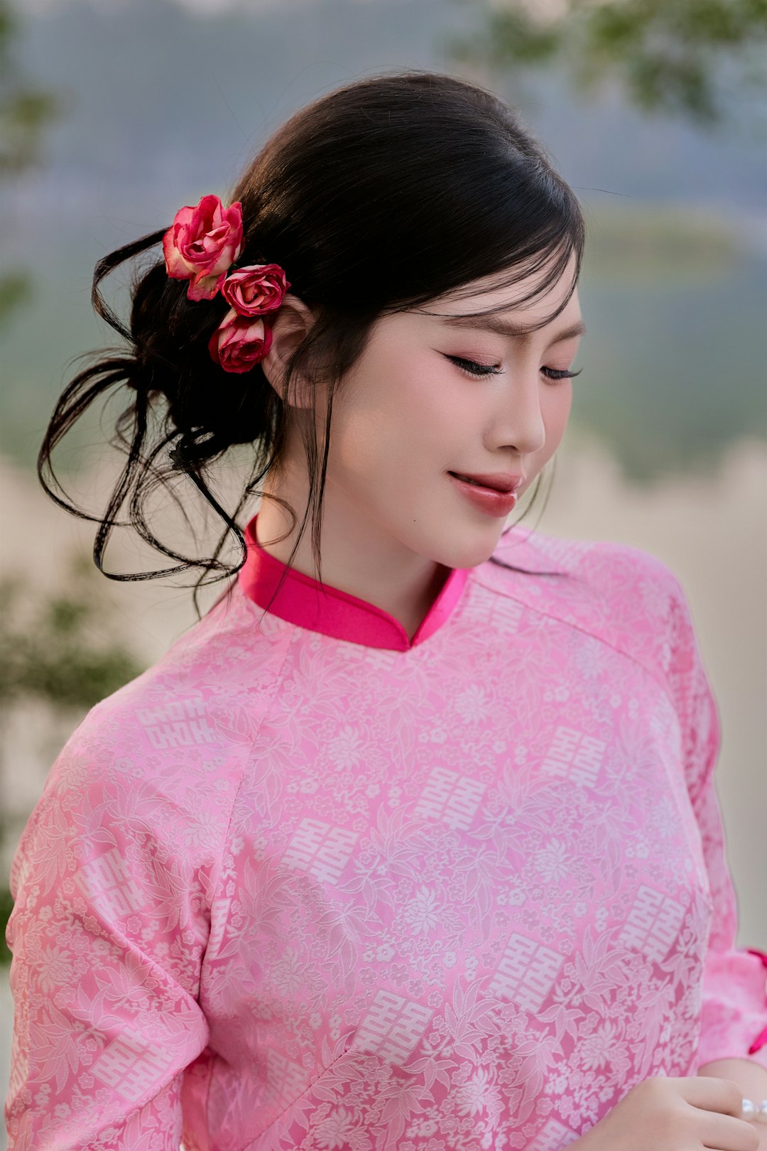 Woman in pink dress with flowers in hair